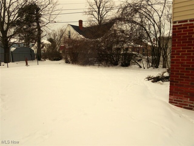 view of yard covered in snow