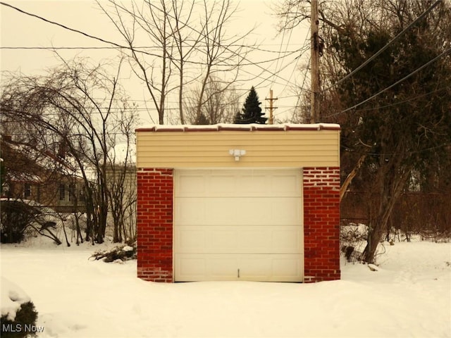 view of snow covered garage