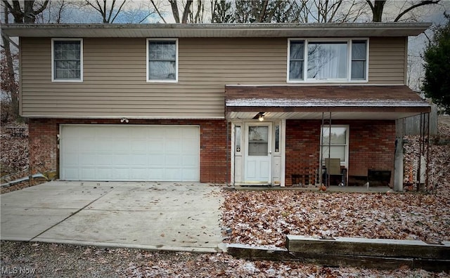 view of front of property featuring a garage and covered porch