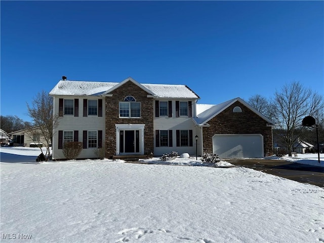 colonial home featuring a garage