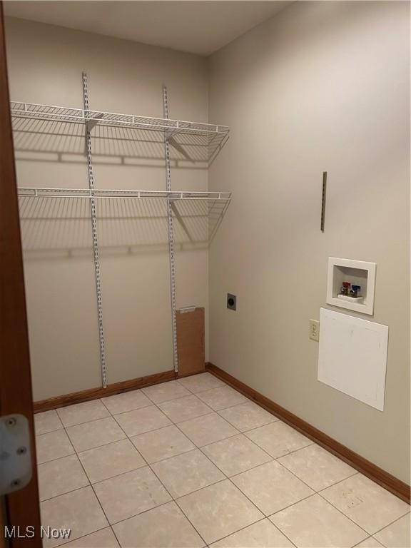 laundry room with light tile patterned flooring, hookup for a washing machine, and electric dryer hookup