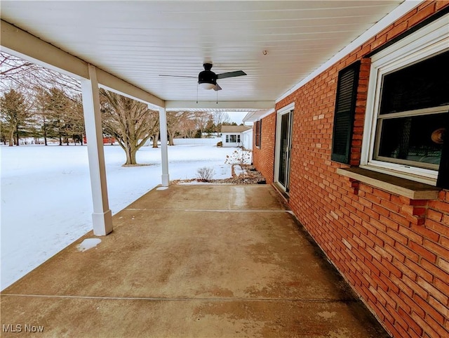 snow covered patio with ceiling fan