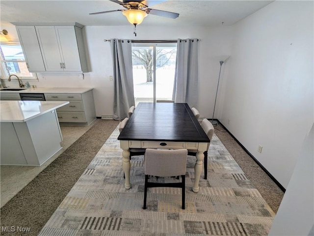 dining room with sink and ceiling fan