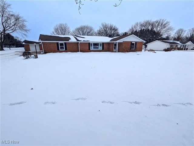 view of yard layered in snow