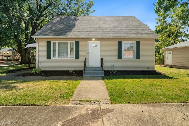 bungalow with a front lawn