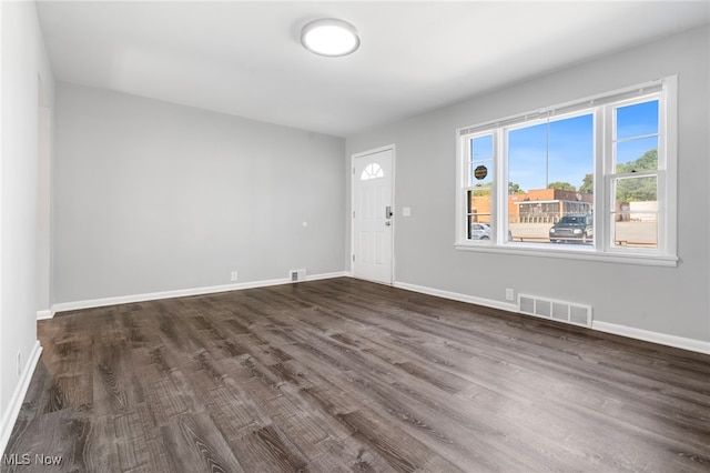 unfurnished room with dark hardwood / wood-style floors