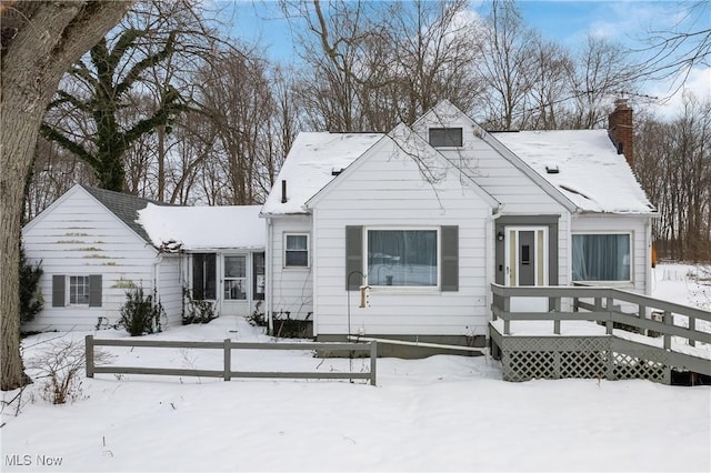 bungalow with a wooden deck