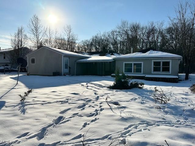 view of snow covered house