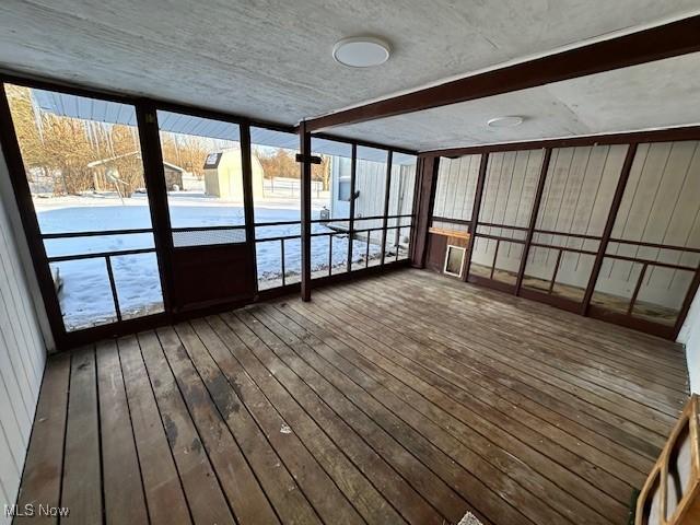 unfurnished sunroom with hardwood / wood-style floors