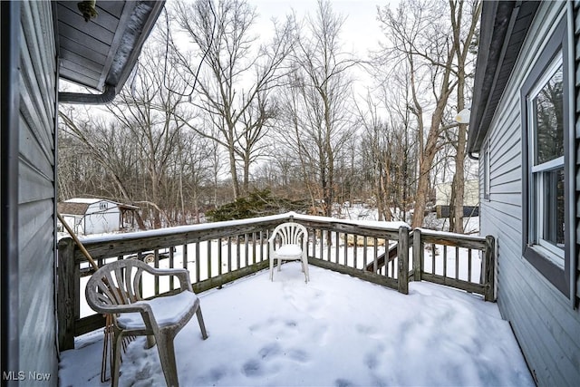 view of snow covered deck