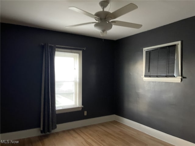 unfurnished room featuring hardwood / wood-style floors and ceiling fan