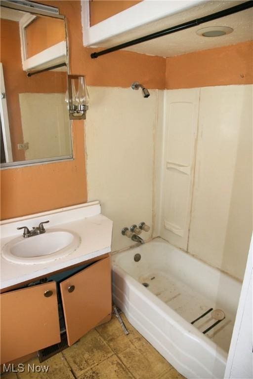 bathroom with vanity and bathtub / shower combination