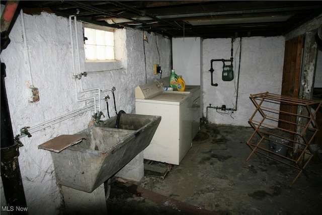 laundry room featuring sink and washer / dryer