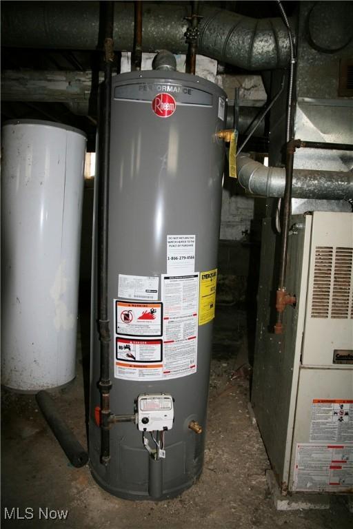 utility room with gas water heater