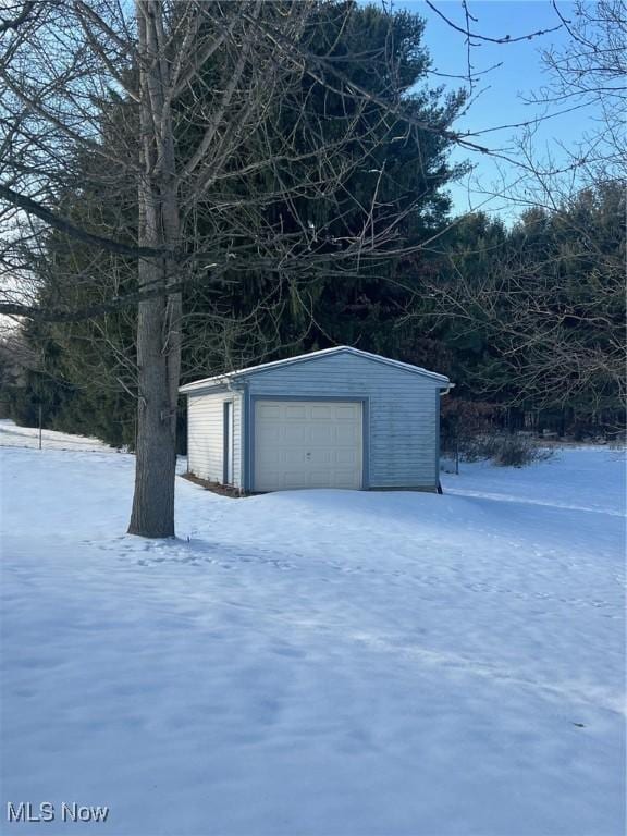 view of snow covered garage