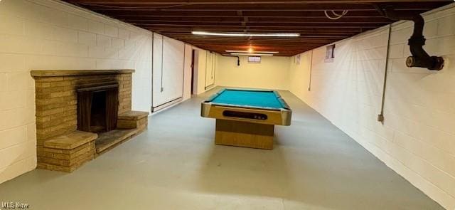 game room with pool table and concrete floors