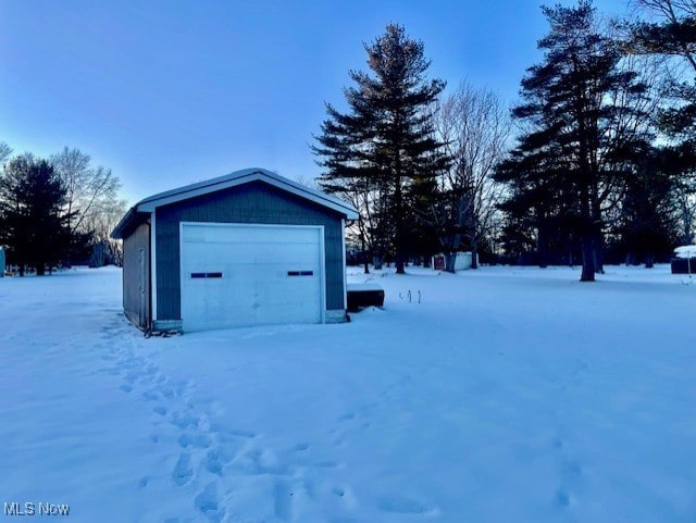 view of snow covered garage