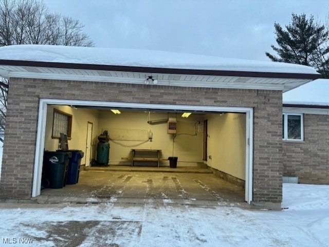 view of snow covered garage