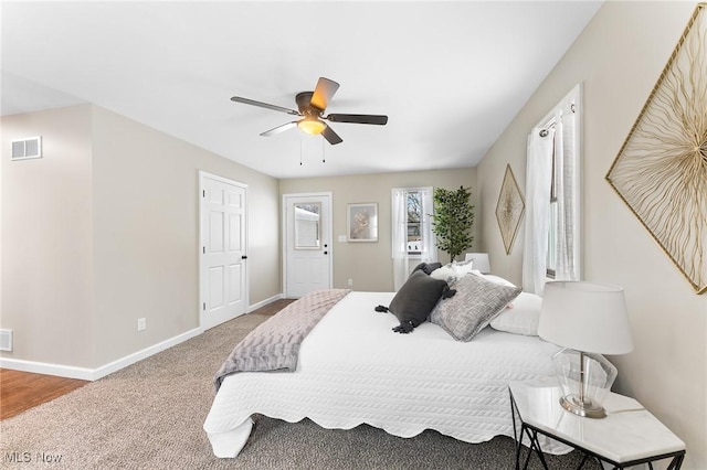 bedroom with ceiling fan and carpet floors