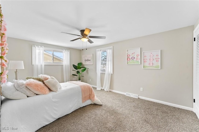 carpeted bedroom with ceiling fan