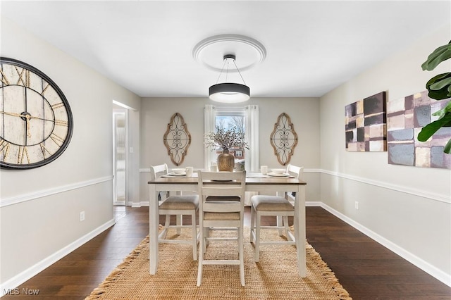 dining area featuring dark hardwood / wood-style floors