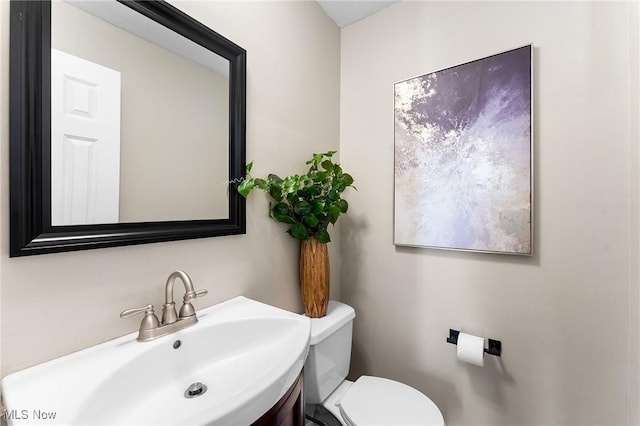 bathroom featuring sink and toilet