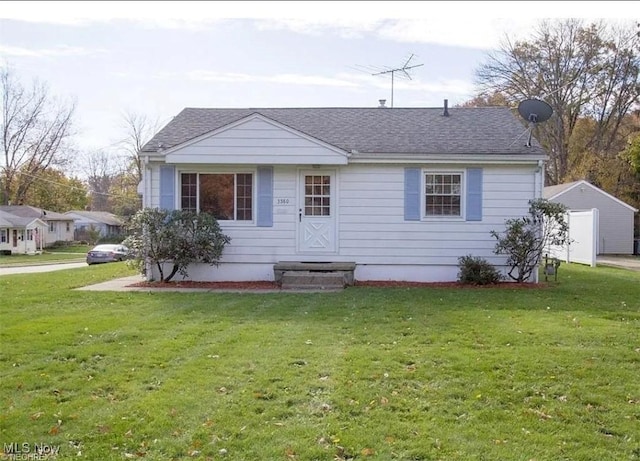 view of front of property with a front lawn