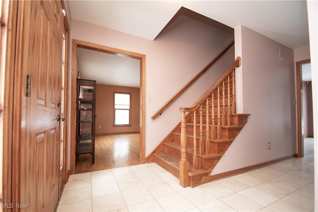 stairs featuring tile patterned floors