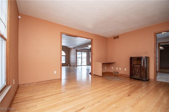 unfurnished living room featuring light hardwood / wood-style floors