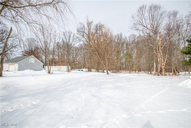 view of yard layered in snow