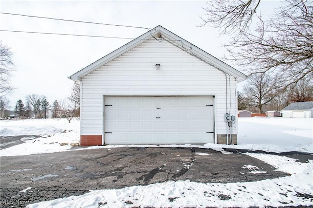 view of snow covered garage