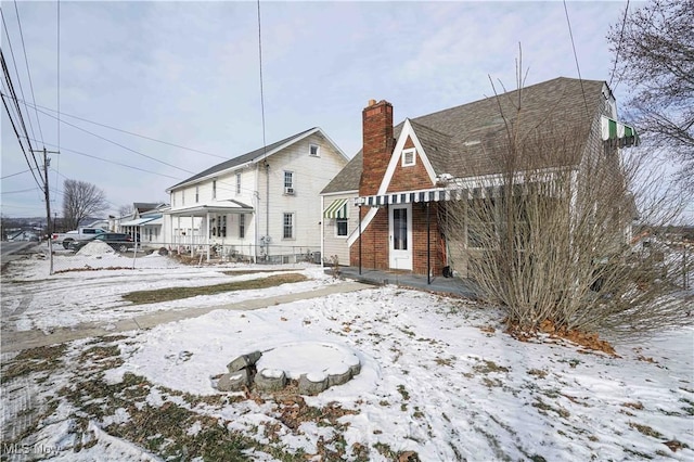 view of snow covered house