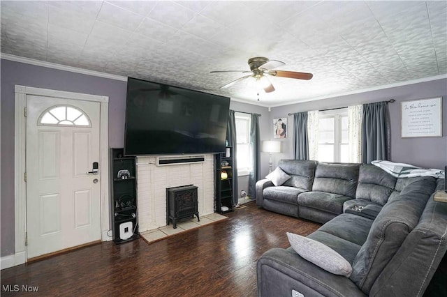 living room featuring crown molding, plenty of natural light, ceiling fan, and hardwood / wood-style flooring