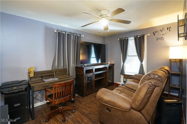 office area with dark wood-type flooring and ceiling fan