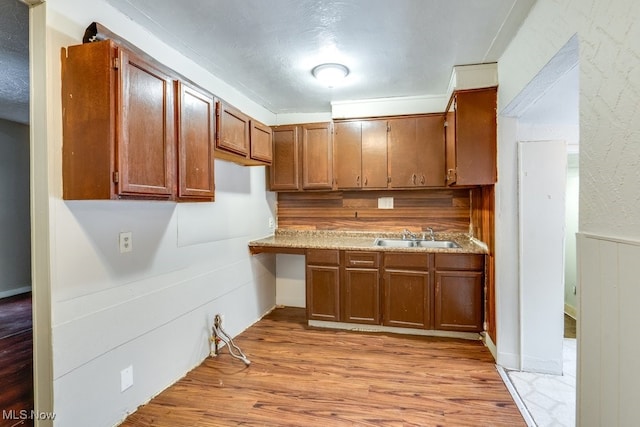 kitchen featuring sink and light hardwood / wood-style flooring