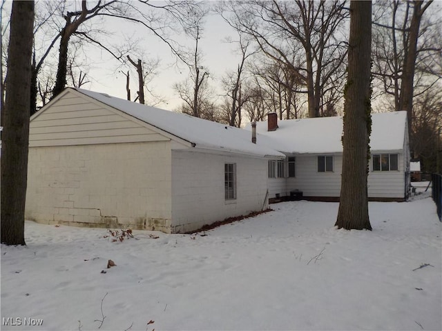 view of snow covered house