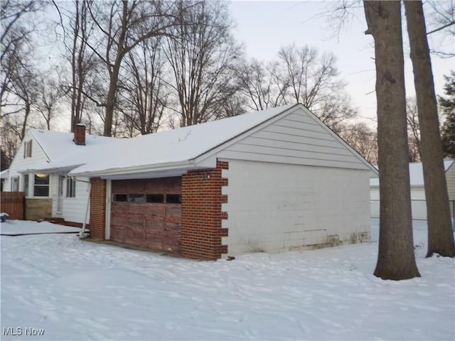 view of snow covered garage