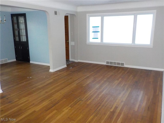 empty room featuring dark hardwood / wood-style flooring