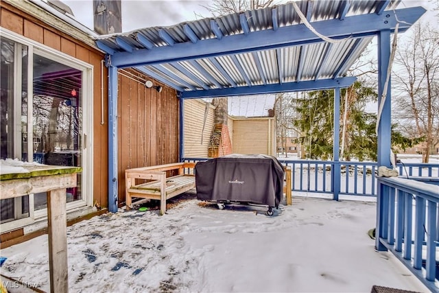 snow covered patio with grilling area