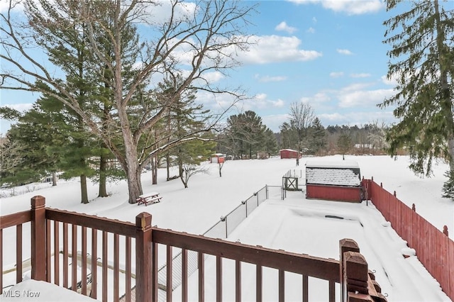 view of yard layered in snow