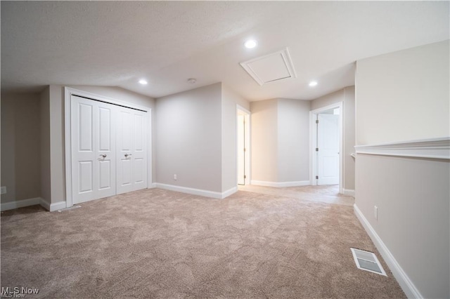 below grade area featuring recessed lighting, visible vents, and baseboards