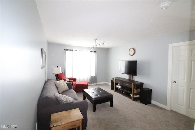 carpeted living room with baseboards