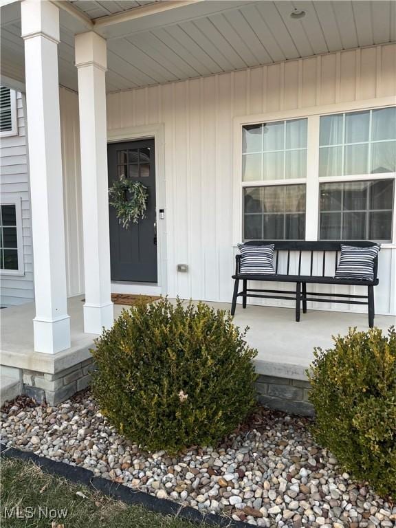 doorway to property featuring a porch