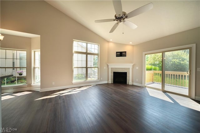 unfurnished living room featuring high vaulted ceiling, dark hardwood / wood-style floors, and ceiling fan