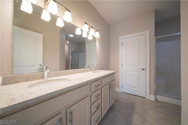 bathroom featuring vanity and walk in shower