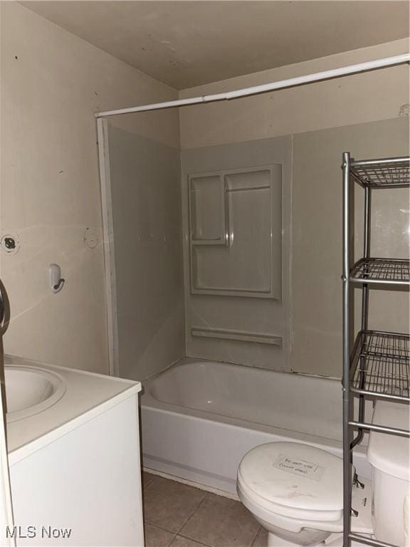 full bathroom featuring vanity, shower / bathing tub combination, tile patterned floors, and toilet