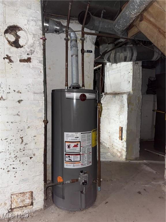 utility room with gas water heater