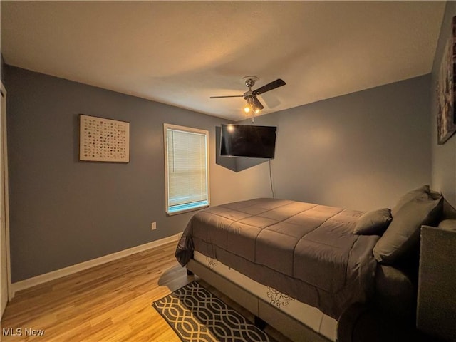 bedroom featuring ceiling fan and light hardwood / wood-style floors