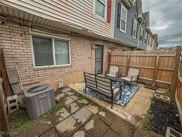 view of patio / terrace with an outdoor hangout area and central AC