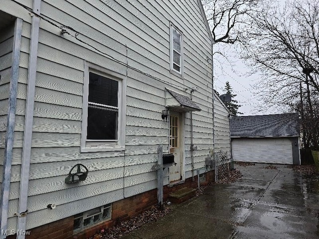 view of home's exterior with an outbuilding and a garage